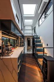 When some people think of tiny houses, they think of a small 16' 'cabin on wheels' which has a single bedroom space that is fine for single people and couples, but clearly not fine for growing families with children. Tiny House Sydney Ultra Modern And Ultra Small The Interiors Addict