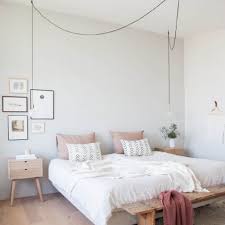 Using layers of coral toned fabrics and accessories brings life and warmth to the design of this relaxing retreat. 23 Scandinavian Bedroom Design Ideas