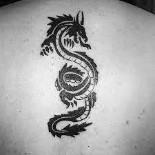 Whether you want small and simple, colorful or black and white ink, this gallery of the best dragon tattoos for guys will provide inspiration for your next piece of unique body art. 60 Simple Dragon Tattoos For Men Fire Breathing Ink Ideas