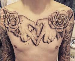 The hands hold the feet in a love symbol pattern with rose flowers beautifully centered on the wrist of both hands. 28 Brilliant Baby Tattoos For Only The Proudest Of Parents Tattooblend
