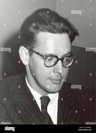 This image shows John Howard Yoder, a prominent theologian, looking down in  a thoughtful pose, likely during a period of reflection or public  appearance Stock Photo