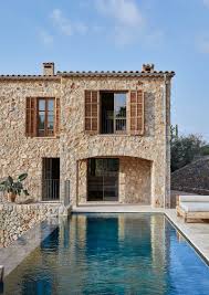 Mallorca is where the sun is shining most time of the year, sea water is clear and beautiful turquoise colour, landscape is stunning, mountains are. Stylish Natural Design Of Stone Villa In Mallorca Photos Ideas Design Architecture Traditional Architecture Villa Style
