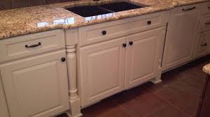 Notice how the floor remains consistent, but the column, in combination with the similarly sized beams, marks the kitchen space. Beautiful Mouser Custom Cabinetry Featuring Staggered Sink Base Fluted Columns And Integrated Dishwasher Vella Bath Kitchen Cabinet Decor Kitchen Cabinetry