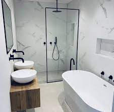 In this bathroom, we paired a warm travertine floor with lots of luxurious fabric. Freestanding Marble Bathroom Modern Bathroom Small Bathroom Layout Bathroom Interior Design