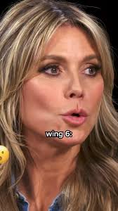 Heidi Klum Strikes a Pose While Eating Spicy Wings