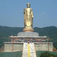 The Spring Temple Buddha Located In Henan China Is The Tallest Statue In The World At 502 Feet The Hill It Stands O Statue Henan Around The World In 80 Days