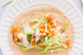 Their green and red sauces were perfect! Fish Tacos With White Sauce And Orange Salsa Nourish Nutrition Blog