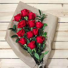 Beautiful bouquet of flowers in the shop. Red Roses Flowers Bouquet Pkgiftshop