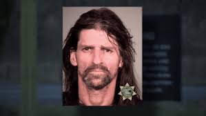 80-year-old woman found dead in suitcase, man arrested