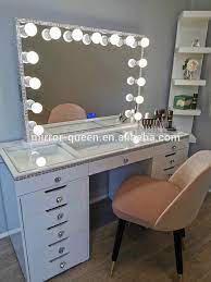 La nouvelle vanité is a make up desk made of american walnut veneer with an arc shaped mirror behind, designed by merve kahraman design studio. Hot Sell Excellent Quality Mdf Glossy Painting Lighted Makeup Vanity Table Bedroom Dresser With Led Lighted Makeup Mirror Buy Beauty Store Makeup Vanity With Lighted Mirror Modern Vanity Table With Vanity Makeup