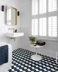 Patterned floor tiles in bathroom. All White Bathroom With Contrasting Patterned Floor Tiles In Blue White And Black The Geometric Cubi Patterned Floor Tiles Blue Tile Floor All White Bathroom