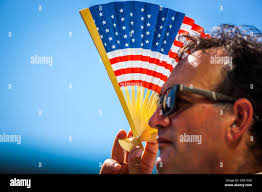 Raising the u s flag hi-res stock photography and images