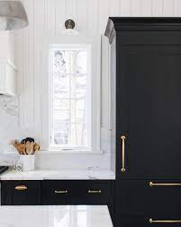 One way to instantly spice up a set of white kitchen cabinets is to finish them with dark countertops like grey or black. Y All This Space Speaks To Me The Black Cabinets Gold Hardware To Die For Marble That Runs Black Kitchen Paint Black Kitchen Cabinets Kitchen Design