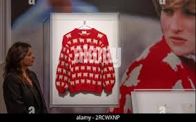 Sotheby's, London, UK. 17th July, 2023. Princess Diana's Black Sheep  jumper, created by Sally Muir and Joanna Osborne (Warm and Wonderful  knitwear label) is set to headline Sotheby's inaugural Fashion Icons sale