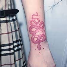 Freehand Red Snake Tattoo On The Left Wrist Artista Tatuador Mirko Sata Red Ink Tattoos Tattoos Snake Tattoo