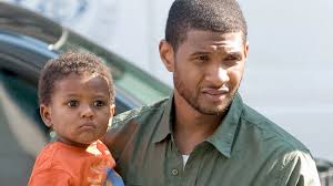 Usher thanks men who saved son's life after swimming pool accident