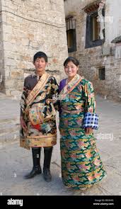 A young Tibetan couple dressed up in ...