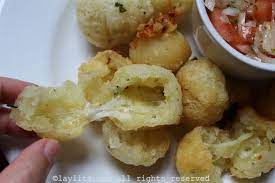 Brazilian Manioc Or Cassava Balls Stuffed With Cheese Bolinho De Macaxeira Laylita S Recipes Brazilian Snacks Recipes Food Processor Recipes