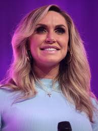 Lara and Eric Trump with their kids Luke and Carolina. Look closely..