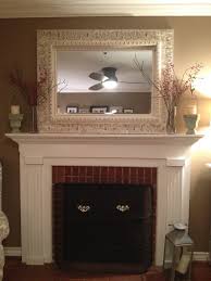 Love The Distressed Mirror Over The Fireplace Fireplace Decor Fireplace Mantel Decor Fireplace Mantels