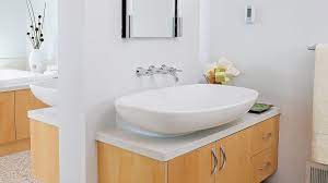 An oversized basket or organizer on a tiny countertop eats away valuable surface space. Bathroom Vanity Counter Sink Ideas Sunset Magazine