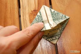 To begin your money origami heart, lay the dollar bill face up and smooth out any wrinkles you see. How To Fold A Dollar Into A Heart