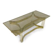 Vintage lucite base coffee table with a naturalist form. 1970s Lucite And Brass Coffee Table
