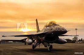 Noteworthy in block 15 is the extended horizontal stabilator, or 'big tail', now standard on these and all subsequent fighting falcons. F16 Falcon Fighter Jet On Sunset Background Foto Poster Wandbilder Bei Europosters