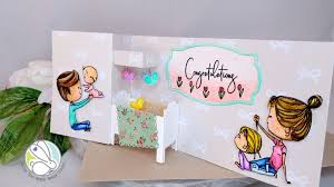 Let guests help with the party decor by stringing up colorful cards with advice and well wishes for the print a banner that spells out the baby's name, congratulations or other sentiment and hang it up where. The Rabbit Hole Designs Pop Up Crib Baby Shower Card