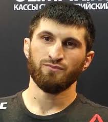 He broke Walker's nose, kicked him in the nuts, kneed him in the head until  he didn't know where he was.... what a beast is Maggie : r/ufc
