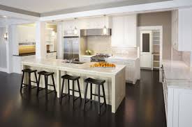 Even the beams and other details on the ceiling are white to brighten and create more space. White Kitchen Countertops With Dark Wood Floors