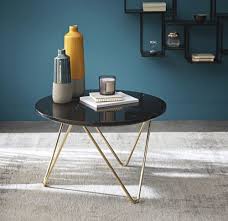 Matériau phare du moment, il se modernise, ici, au contact des pieds en métal doré. Table Basse En Marbre Noir Et Metal Dore Eagle Maisons Du Monde