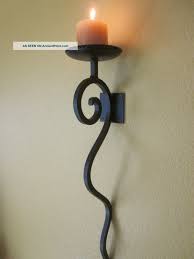 Check out our wrought iron wall candle holder selection for the very best in unique or custom, handmade pieces from our sconces shops. Candle Wall Sconces Tuscan Candle Wall Sconce Hand Forged Iron Antique Brown Finish 24 Candle Wall Sconces Wall Candles Iron Wall Sconces