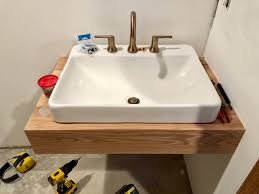 Diy mdf bathroom countertop for an undermount then i drilled a pilot hole in one corner to use as a starting point to use a jigsaw to cut the sink hole. Week 4 Guest Bath Diy Floating Oak Vanity Construction2style