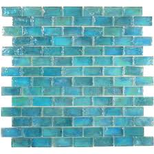 The Uniform Brick Tile Shape Of These Lovely Aqua Blue Glass Tiles May Be On The Straight And Narrow But Iridescent Glass Tiles Sea Glass Tile Blue Glass Tile