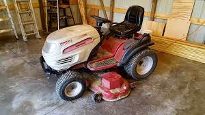 Steering Repair On White Outdoor Lawn Mower By Mtd Lawn Mower Outdoor Lawn Mower