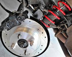 Since it can get hot, the car is filled up. Newly Installed Brakes Brake Drums And Shocks On A Sports Car Do It Yourself Projects In The Garage Installing New Brakes Drums And Shocks Are Easy For A Home Mechanic Stock Photo