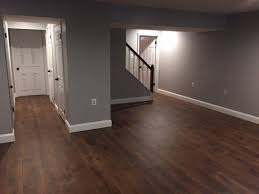 Mohawk Midday Mocha Oak Laminate Flooring Behr S Gentle Rain Paint Basement Remodeling New Homes Flooring