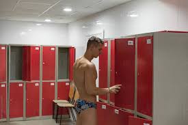 Muscular Man In Pool Locker Room by Stocksy Contributor Milles Team -  Stocksy