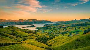 Scenic View Of Landscape Against Sky During Sunset Stock Photo