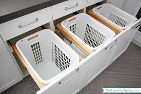 Hampers are simple to remove and carry to the laundry room with one hand Downstairs Laundry Room The Sunny Side Up Blog