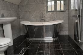 And if a heavy object falls on the marble, it is possible to form a chip or pothole. Black Marble On The Floor White Marble Bathrooms Black Tile Bathrooms White Marble Tile Bathroom