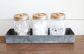 Fill it with sorted food storage container lids, then place the containers underneath their corresponding lids. Decorative Mason Jar Bathroom Storage Little House Of Four Creating A Beautiful Home One Thrifty Project At A Time Decorative Mason Jar Bathroom Storage