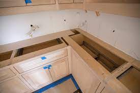Installing kitchen cabinets on unlevel floor. How To Install Custom Cabinets