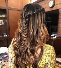 Having braids and curly hair is a great hairstyle for anyone going to a festival or concert! Easy Half Updo Hairstyles For That Dreamy Mehndi Look Wedmegood