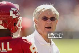Cornerback Eric Warfield of the Kansas City Chiefs gets a hug from... News  Photo