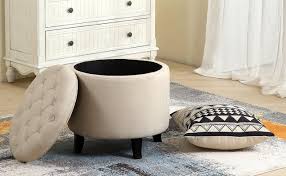 Unique low profile square white tufted ottoman centers this living room with full mirrored table top surface over dark rug on white marble flooring. 14 Best Small Ottoman Options For 2021 Home Stratosphere