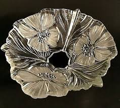 > lovely clear cut glass compote bowl with stemmed base, like an oversized shallow wine glass > has an etched design around the bowl, featuring six petaled blossoms intertwined with a leaf vine, and added detail of closely spaced vertical lines with rounded ends > measures 8 across x 5 tall. Bowls Frosted Glass Bowl Vatican