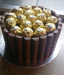 Giant Ferrero Rocher Cake Chocolate Cake Chocolate Covered Fudge Bars Ferrero Rocher Topping Sweet Cakes Chocolate Recipes Ferrero Rocher Cake