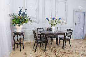 100% polyester cushions are available in dark gray, light gray, orange, and green to personalize your dining room or kitchen. Table Chairs In The Interior Classic Dining Room With Candles And Flowers In Vases Stock Photo Picture And Royalty Free Image Image 116066335
